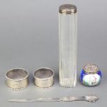 A silver paper knife with scroll grip Birmingham 1971, a silver mounted toilet jar, 2 napkin rings