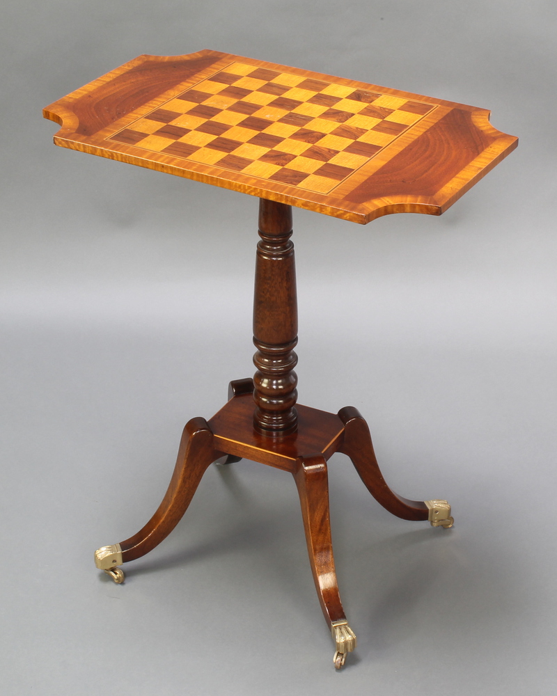 A 19th Century style shaped and inlaid mahogany chess table, raised on pillar and tripod base with