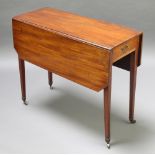 A 19th Century rectangular mahogany drop flap dining table fitted a frieze drawer and raised on