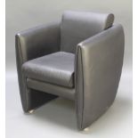 Boss Designs, a mid 20th Century arm chair upholstered in black simulated leather
