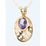 A 9ct yellow gold amethyst set pendant on a ditto chain, gross 4 grams