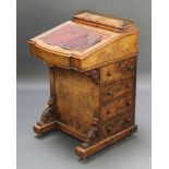A Victorian inlaid figured walnut Davenport desk with stationery box to the top and brown leather