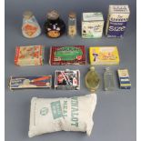 A glass jar of Bovril, a small sack of Winalot meal and other items of packaging