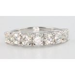 An 18ct white gold 7 stone diamond ring, the brilliant cut stones approx. 1.73ct, size N 1/2