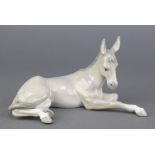 A Lladro figure of a reclining donkey 5.83, 8 1/2", boxedThis lot is in good condition.