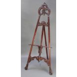 A 19th Century style carved mahogany easel, 78"h A small section of carving is missing to the
