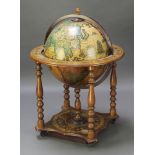 A mid 20th Century cocktail cabinet in the form of a terrestrial globe, 36"h x 27 1/2"diam. There is