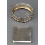 A silver engine turned cigarette case Birmingham 1926, a silver dish holder and a miniature glass