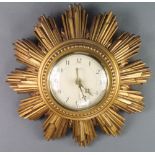 A Smiths battery operated wall clock with paper dial and Arabic numerals contained in a gilt painted