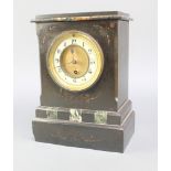 A Victorian mantel timepiece with enamelled dial and Arabic numerals contained in a black