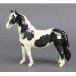 A Beswick figure of a dappled horse 9"