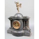 A Victorian 8 day striking mantel clock contained in a black marble architectural case surmounted by