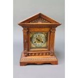 A Victorian striking bracket clock with square gilt dial and silvered chapter ring contained in a