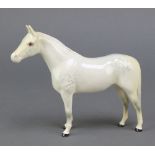 A Beswick figure of a white dappled horse 7"