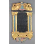 A rectangular plate wall mirror contained in a carved gilt wood frame supports by 2 columns 26"h x