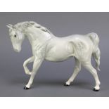 A Beswick figure of a grey and dappled horse with raised front right leg 11"