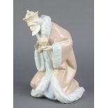 A Lladro figure of Melchor 5479, 9 1/2", boxedThe urn is stuck to his hand, this lot is otherwise in