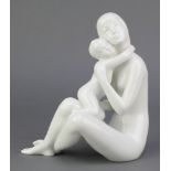 A Royal Dux white glazed figure of a seated mother holding a child 8" This lot is in good