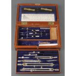 A chrome geometry set marked WHH Ltd. with ebonised parallel rule and gauge all marked with a