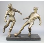 A bronze figure group of 2 footballers, raised on a rectangular black veined marble base 20"h x 18"w