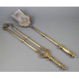 A pair of 19th Century reeded brass fire tongs and a shovel