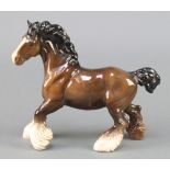 A Beswick figure of a standing brown shire horse 10"