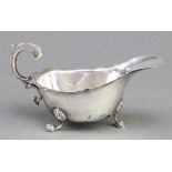 A silver sauce boat of plain form with claw feet Birmingham 1940, 80 gramsOne foot is bent