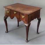 An 18th Century oak low boy fitted 1 long and 2 short drawers, raised on cabriole supports 27"h x 30