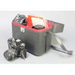 A Zenith E M camera with Helios 1:2.8 lens, a Helios-44mm 2/58 lens, an Intercity auto lens 1:5.5