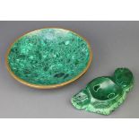A malachite ashtray in the form of an arrangement of fruit 9" and a circular malachite dish 11"