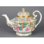 A 19th Century Cantonese famille rose teapot decorated with figures in an extensive landscape