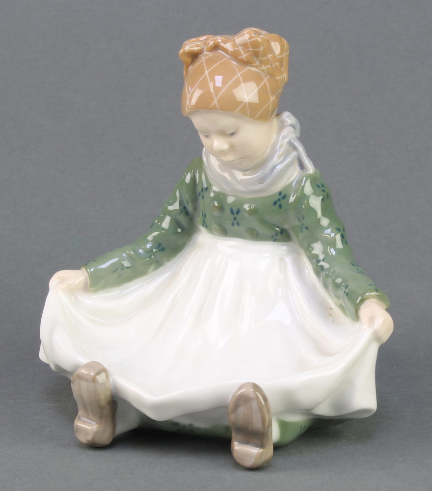 A Royal Copenhagen dish in the form of a young girl holding out her apron