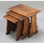 A nest of 3 rectangular oak interfitting coffee tables, raised on shaped supports 19"h x 22"w x 14"