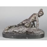 A bronze figure of a recumbent lady raised on an oval base 8"