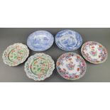 A pair of Victorian Ironstone plates decorated with flowers 9 1/2", a similar pair 9", a blue and