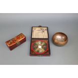 A Chinese Feng Shui compass contained in a lacquered box, a rectangular Chinese pillow box with