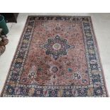 A Persian tan ground Tabriz carpet with central medallion 150" x 118", signed, some wear and moth to