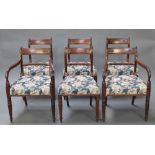 A set of 6 Regency carved mahogany bar back dining chairs with over stuffed seats, raised on tapered