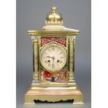 A 19th Century French 8 day striking mantel clock with silvered dial and Roman numerals, contained