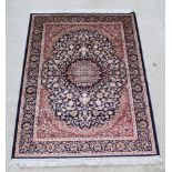 A blue and red ground Keshan style Belgian cotton rug with central medallion 76" x 52"