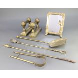A pair of Victorian brass railed fire dogs, a brass poker, coal shovel, pair of tongs, toasting