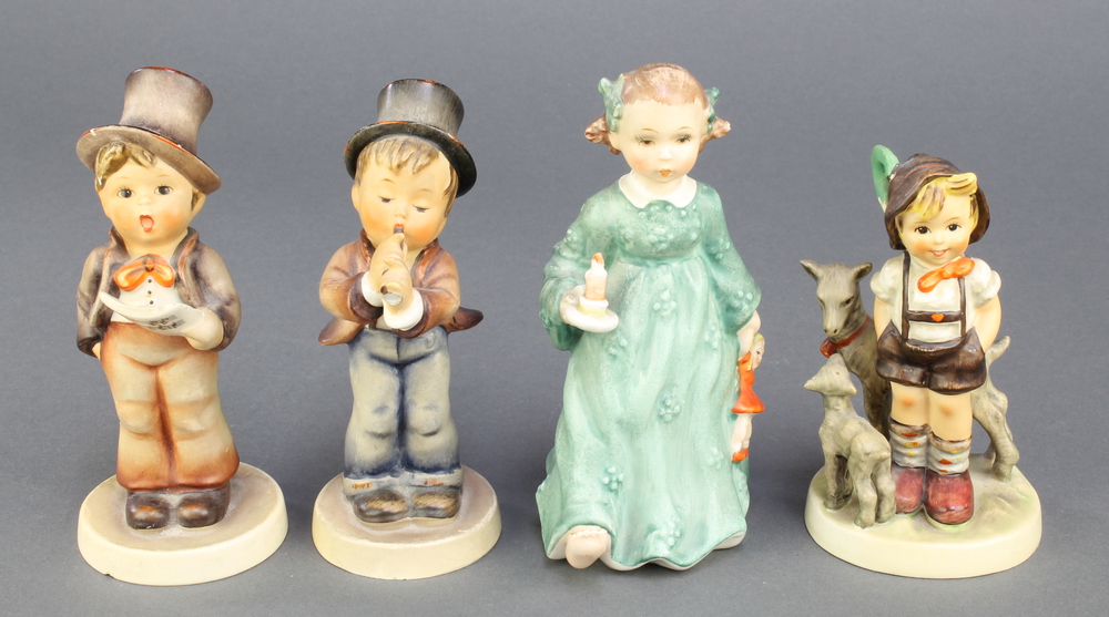 4 Hummel figures - girl with chamber stick 17 5 1/4", boy with song sheet 737 5 1/4", boy with flute