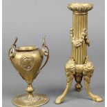 A 19th Century reeded gilt ormolu candlestick with swag decoration, raised on 3 out swept paw feet