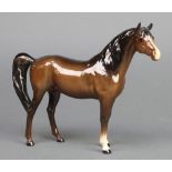 A Beswick figure of a standing horse, 6"