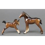 A Beswick figure of a brown foal 4 1/2", a ditto with legs outstretched 2 3/4"