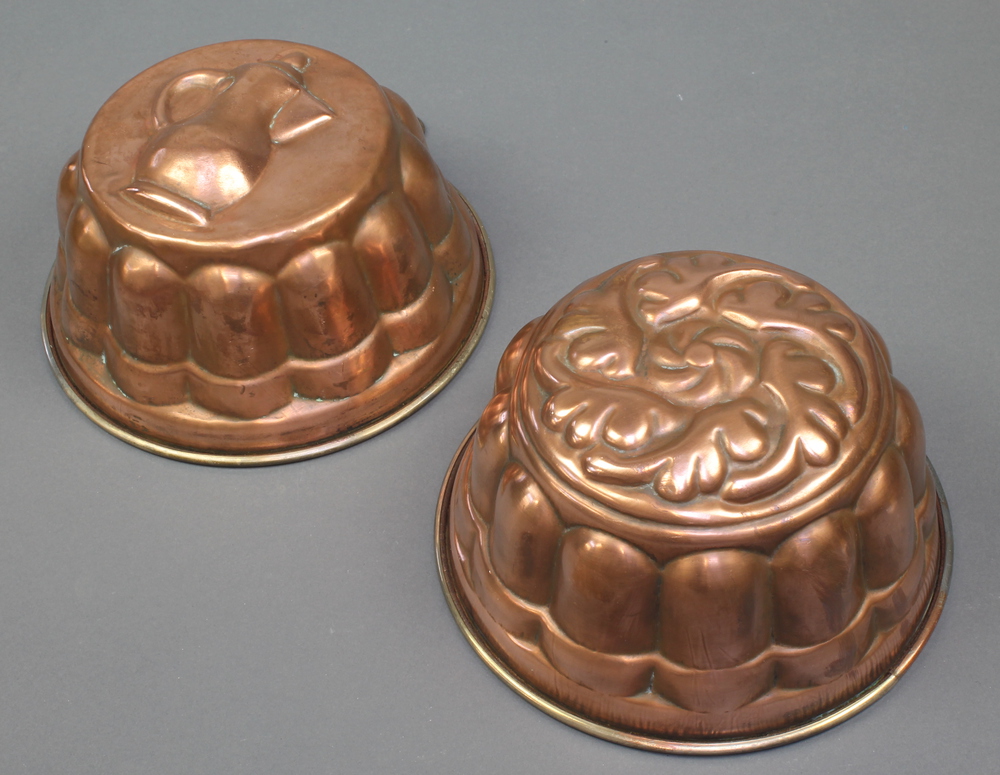 2 reproduction copper jelly moulds 8" together with a copper warming pan with engraved lid and