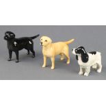 3 Beswick figures of dogs - blue roan cocker spaniel 4", black retriever 5 1/4" and golden retriever