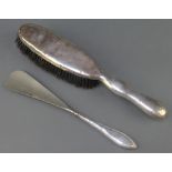 A Victorian silver clothes brush Birmingham 1898 and a silver handled shoe horn