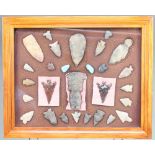 A collection of 27 native American Indian artefacts together with a carved stone figure of a Deity