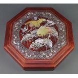 An octagonal Chinese red lacquered hors d'oeuvres box the mother of pearl decorated lid with heron